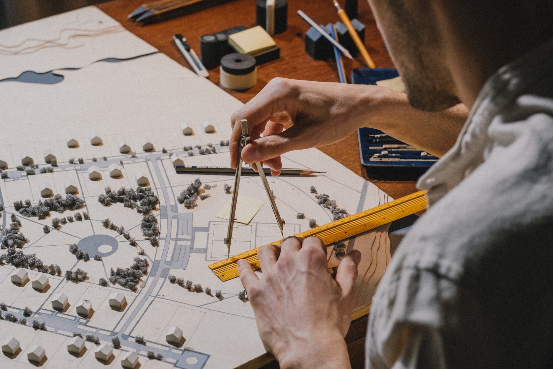 Architect working with architectural model